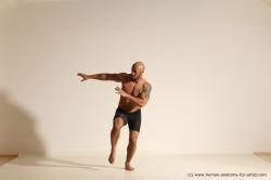 Underwear Gymnastic poses Man Black Muscular Bald Dancing Dynamic poses Academic